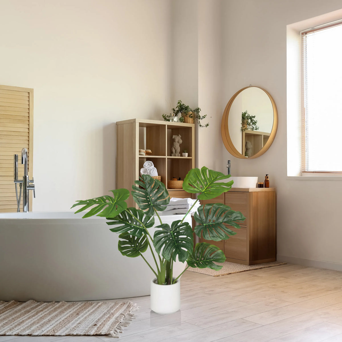 Green artificial plant MONSTERA I in a white pot in a bathroom by hjh OFFICE