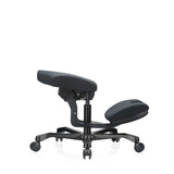 EvoShift kneeling chair in black with padded seat and knee rest on a five-star base with castors by hjh OFFICE