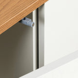 Grey door stopper on the oak-coloured top of the Sideboard KELO S by hjh LIVING
