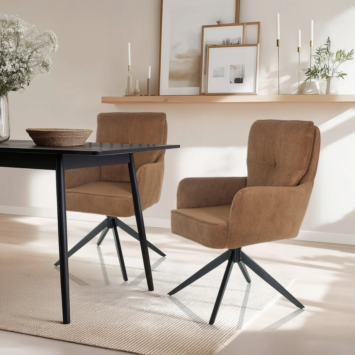 Two brown upholstered chairs TARUGO with black star bases at a black table by hjh LIVING