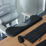 Black RELEX RT2 armrest on a desk next to a keyboard and a computer mouse by hjh OFFICE