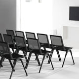 Several black MEET WA guest chairs with mesh backrests in a row by hjh OFFICE