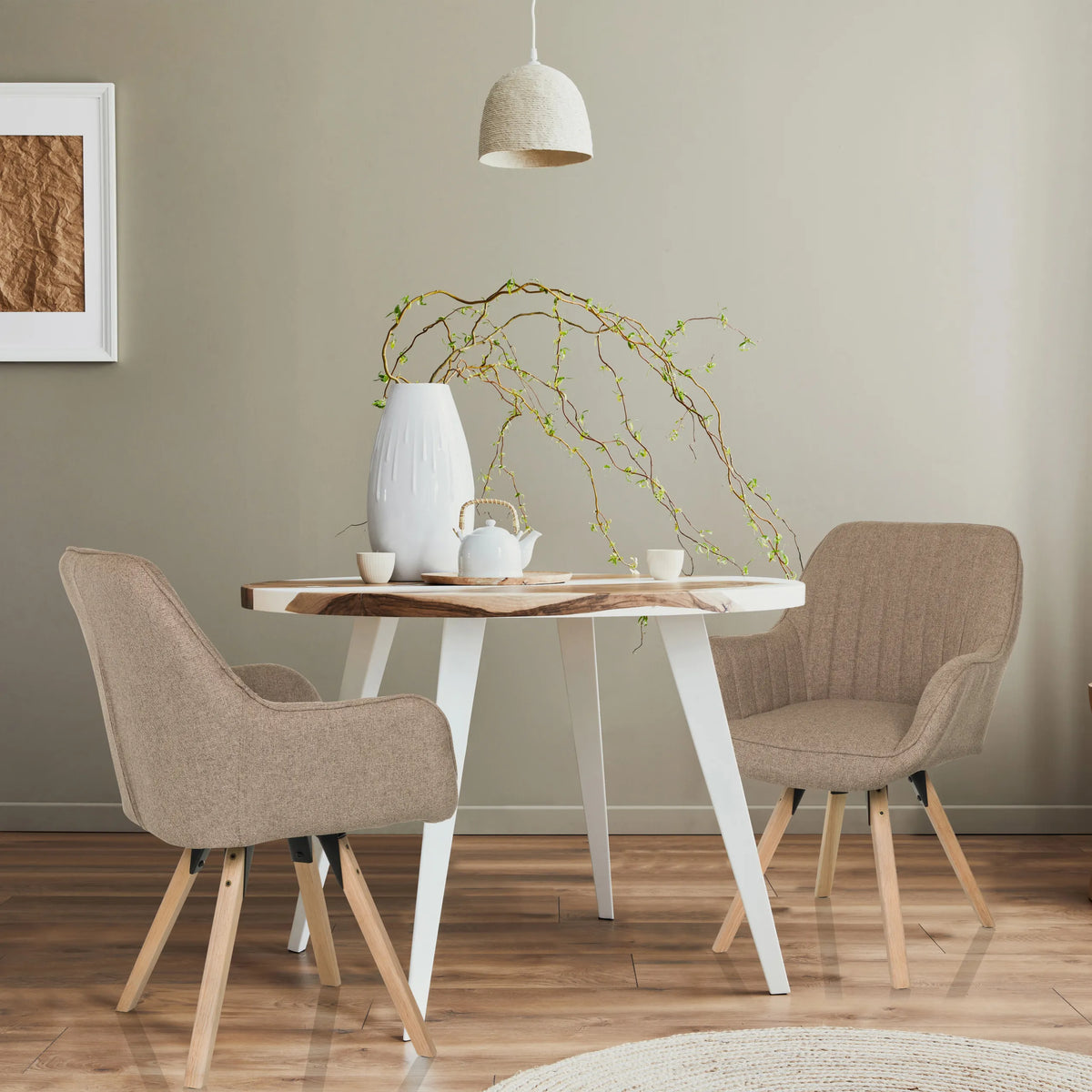 Two beige SCANDI SOFT upholstered chairs with wooden legs at a round dining table by hjh LIVING