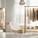 White upholstered chair SCANDI TED with light wooden legs in a bright room by hjh LIVING