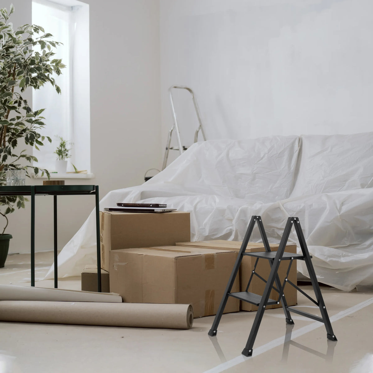 Black Folding Ladder SOLID W5 with two steps in a room with moving boxes by hjh OFFICE