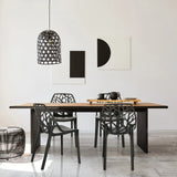 Outdoor chair ARTIFO TRI in black with mesh backrest at a wooden table by hjh OFFICE