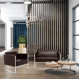 Brown upholstered armchair ARUBA with white metal frame in a modern office environment by hjh OFFICE
