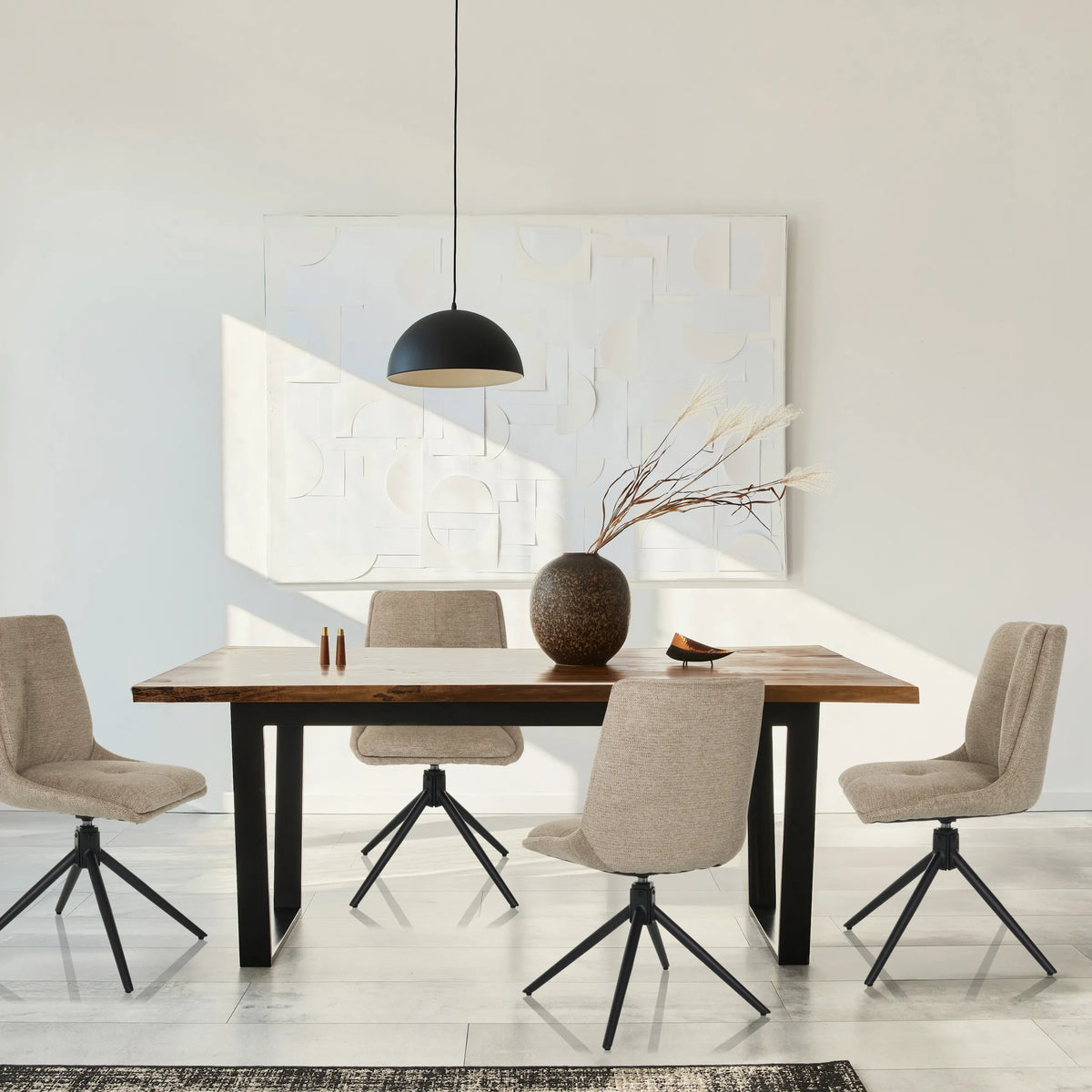 Four beige upholstered chairs TARVISO I with black star bases at a wooden table by hjh LIVING