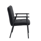 Side view of the Lifea Flex upholstered chair with black faux leather cover and armrests by hjh LIVING