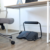 Black PODI F footrest with non-slip tread and padded crossbar under a desk by hjh OFFICE