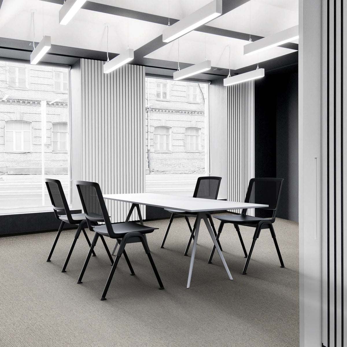 Four black MEET WA guest chairs at a white conference table in a modern office by hjh OFFICE