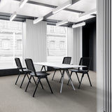Four black MEET WA guest chairs at a white conference table in a modern office by hjh OFFICE