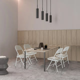 Four grey TUDELA W folding chairs with faux leather upholstery at a table by hjh OFFICE