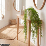 Green artificial plant Filix in a ribbed white outer pot on a wooden console table by hjh OFFICE
