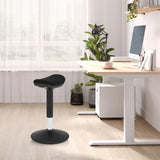Black standing aid BALANCE SIT I B with round base and padded seat in a bright office by hjh OFFICE