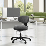 Grey SITMOTION B home office chair with castors in front of a white desk in a bright office by hjh OFFICE