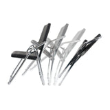 Four black ESTO folding chairs with chrome frames in a staggered arrangement by hjh OFFICE