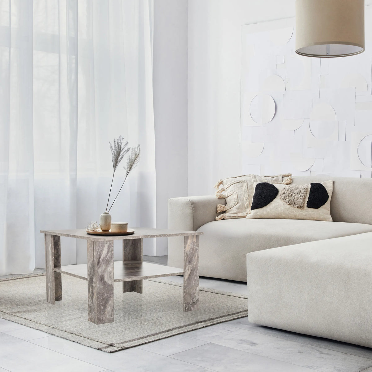 Grey BISMO coffee table with marble effect, two levels and a square shape in a living area by hjh LIVING