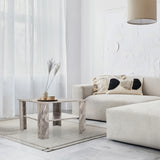 Grey BISMO coffee table with marble effect, two levels and a square shape in a living area by hjh LIVING