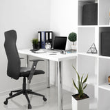 Black Home Office Chair ARTON 30 with armrests and castors at a white desk by hjh OFFICE