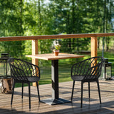 Two black BEGIO B shell chairs with a grid structure at a wooden table by hjh OFFICE