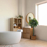 Artificial plant PACHIRA in green in a woven basket in a bright bathroom by hjh OFFICE