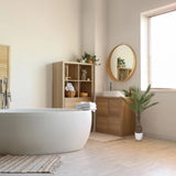 Green artificial plant DRACAENA in a white pot next to a bathroom base cabinet by hjh OFFICE