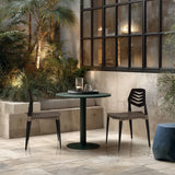 Two Flecharo outdoor chairs in brown and black at a round table by hjh LIVING