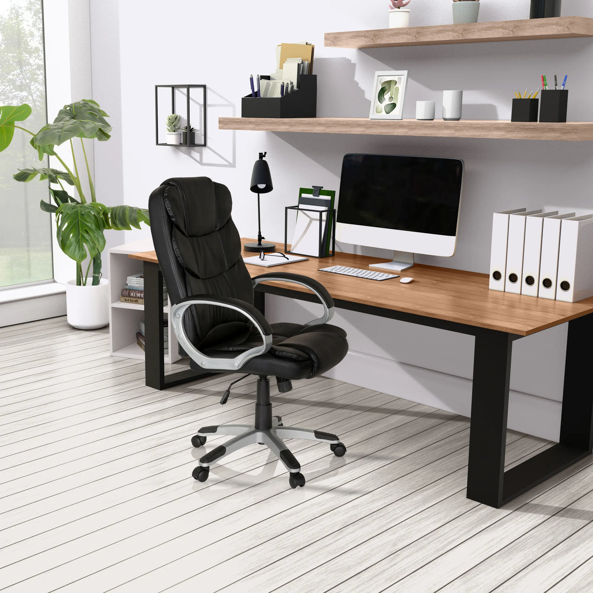 Home Office Executive Chair RELAX BY155 in black with armrests in front of a desk by MyBuero