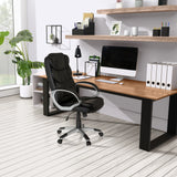 Home Office Executive Chair RELAX BY155 in black with armrests in front of a desk by MyBuero