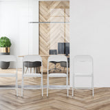Four white PVC folding chairs TUDELA BASIC in a row in front of a glass wall by hjh OFFICE