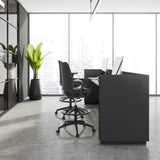 Two black Counter chairs NESTORA WORK with footrests and castors at a modern desk by hjh OFFICE