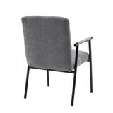 Rear view of the grey upholstered armchair Lifea Flex with black metal legs and armrests by hjh LIVING