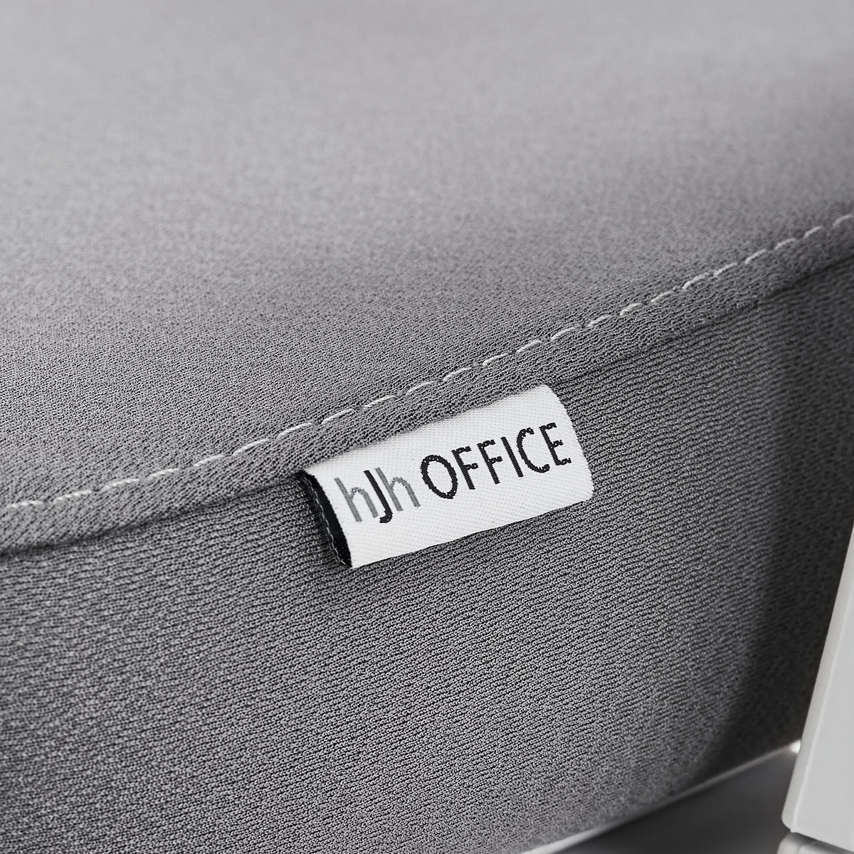 Brand label on the grey fabric upholstery of the Professional Office Chair Ergomy WF 2 by hjh OFFICE