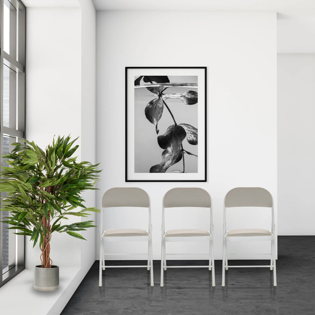 Three grey TUDELA W folding chairs with faux leather upholstery in a bright room by hjh OFFICE