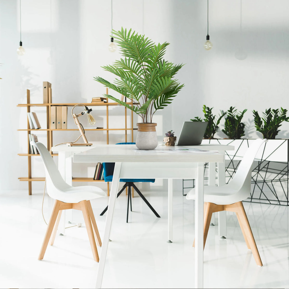 Green artificial plant ARECA in a light grey outer pot on a white desk by hjh OFFICE