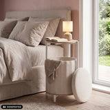 Side table Nestup 1 in white and oak next to a bed by hjh LIVING (AI-generated image)