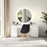 Shell chair SCANDI 4 in black with four light wooden legs in front of a dressing table by hjh OFFICE