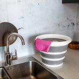 Grey and white Folding container CLEAN SILR with a pink cloth on a work surface next to a sink by hjh OFFICE