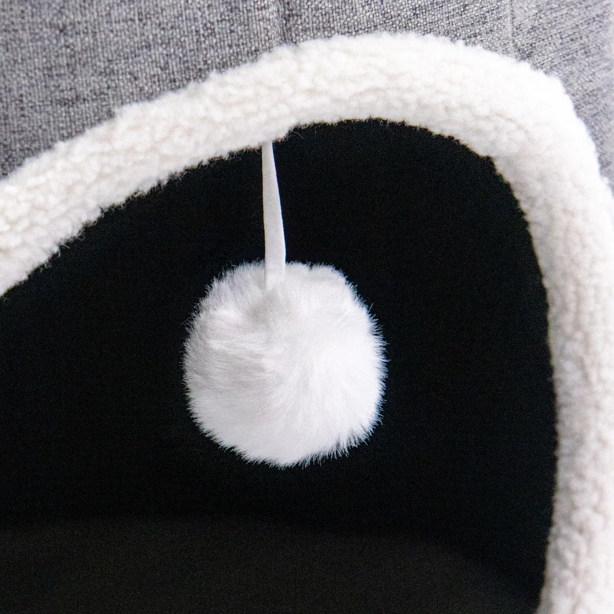 White play ball on a string inside the PAWY R cat cave by hjh LIVING