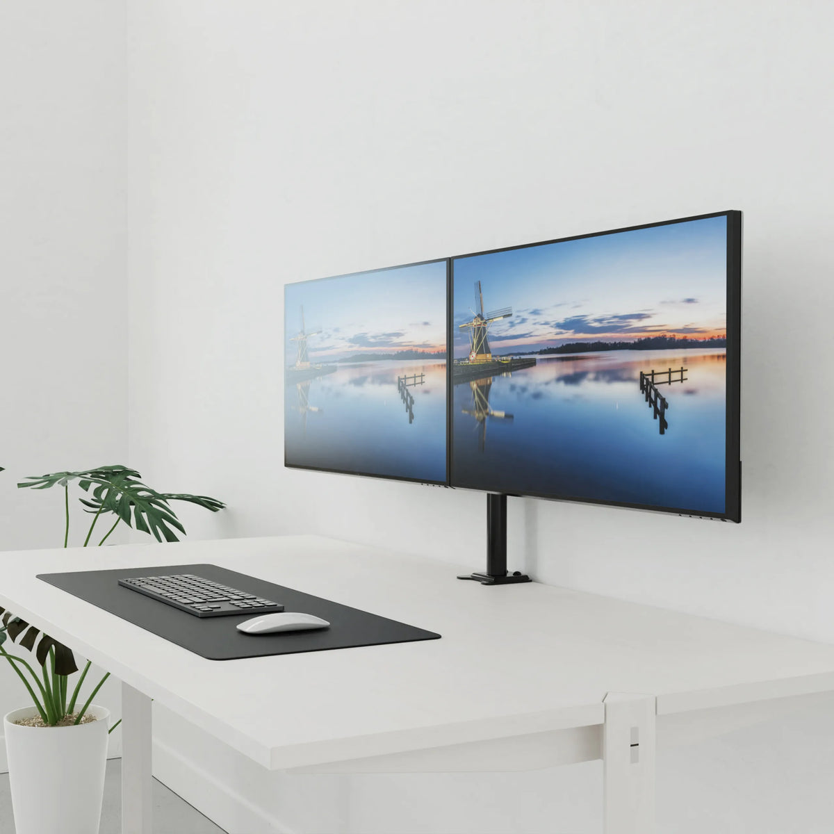 Black Monitor Mount Ergomount M2 for two screens on a white desk by hjh OFFICE