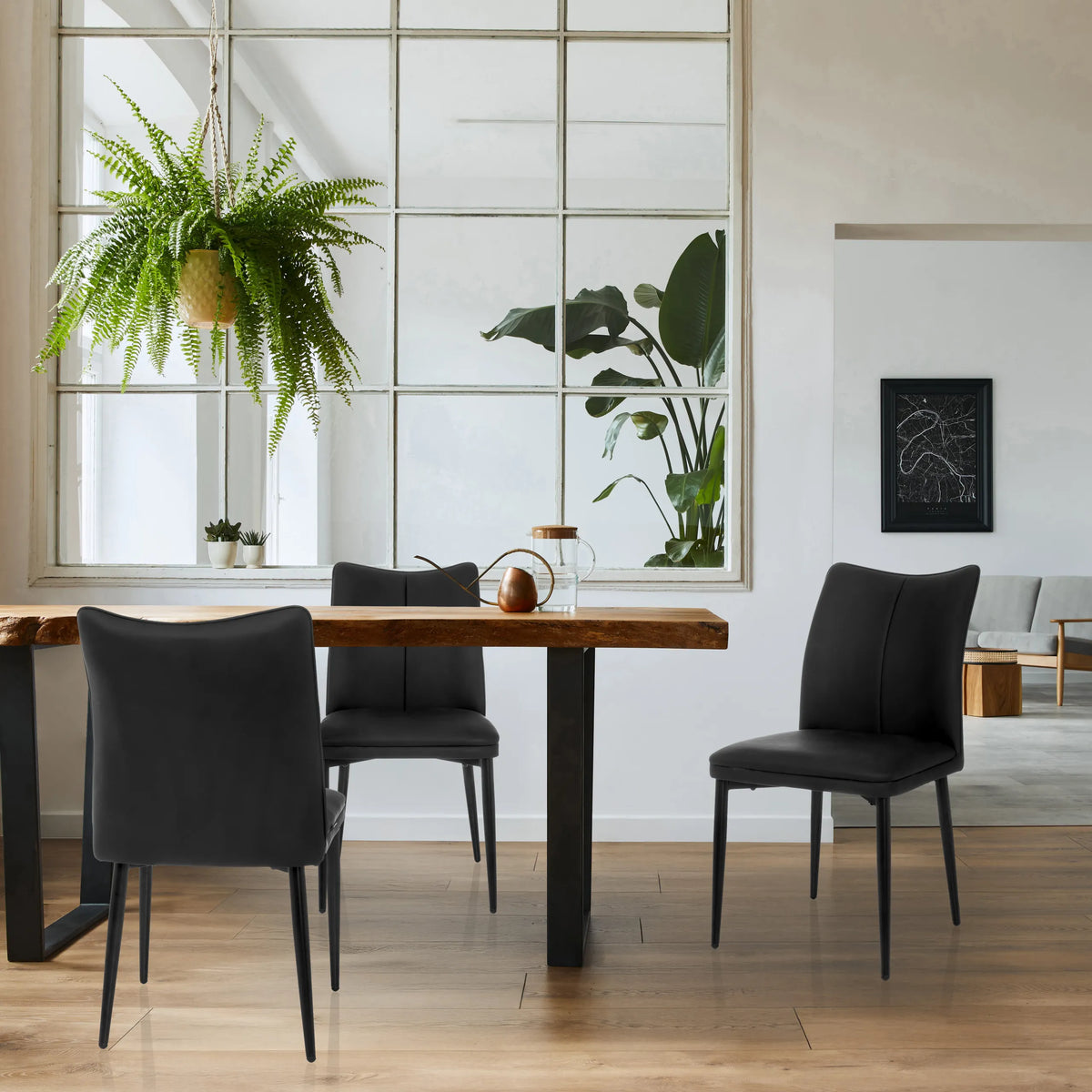 Three black VISETO dining chairs with quilted backrests at a wooden table by hjh LIVING
