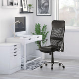Home Office Executive Chair ARTON 20 in black with mesh backrest and armrests in front of a white desk by hjh OFFICE