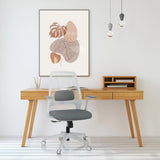 Grey PARFERIO W home office chair with mesh backrest and castors in front of a desk by hjh OFFICE