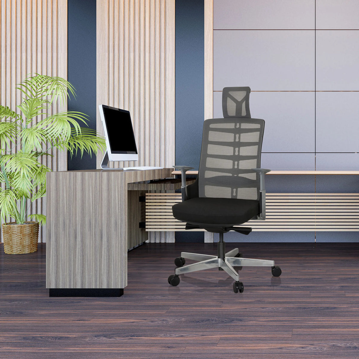 High End Office Chair SKARIF in black-grey in front of a desk in a modern office by hjh OFFICE