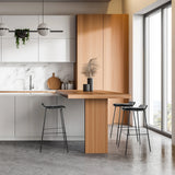 Three black LONSO 10 bar stools at a wooden kitchen counter in a modern kitchen by hjh OFFICE