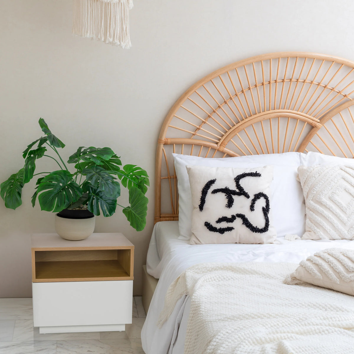 White side table MELMO with open shelf in oak effect next to a bed by hjh LIVING