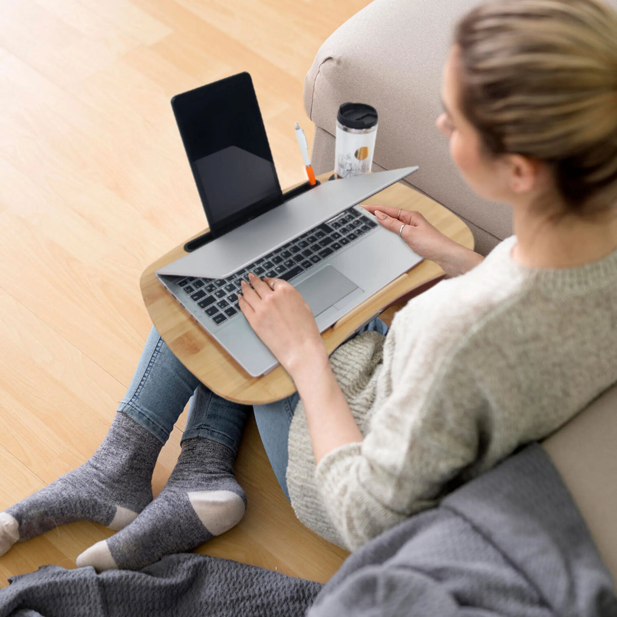 Brown wooden Laptop Pad COMFILAP I by hjh OFFICE with a laptop in use