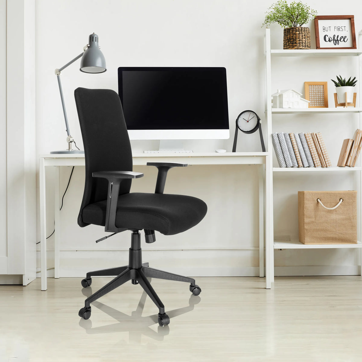 Black Home Office Chair COSIO I with armrests and castors at a white desk by hjh OFFICE