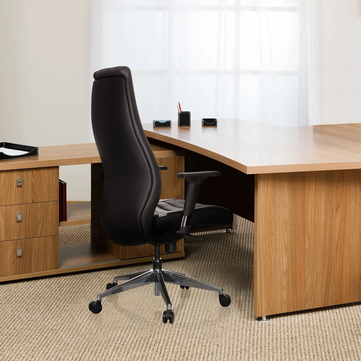 Black Professional Executive Chair VITORO with armrests and star base at a desk by hjh OFFICE